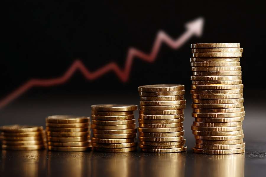 Des piles de pièces de monnaie illustrant la progression de la rentabilité locative sur un graphique.